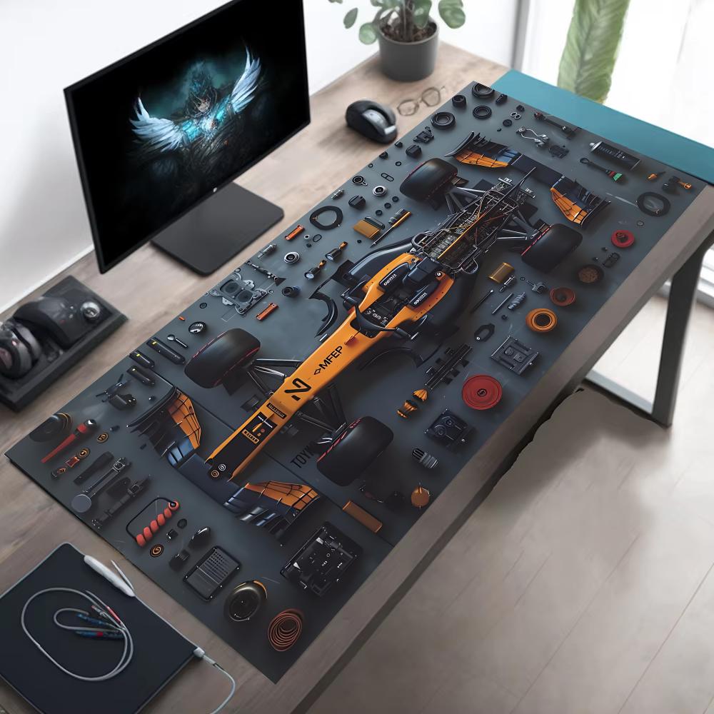 Large racing car gaming mouse pad folded flat on a desk
