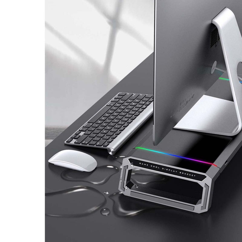 Monitor stand holding computer and organizing desktop workspace efficiently